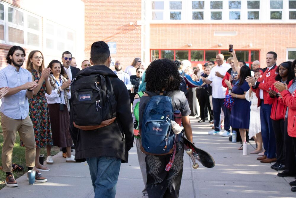 Manual students walk the red carpet on the first day of school