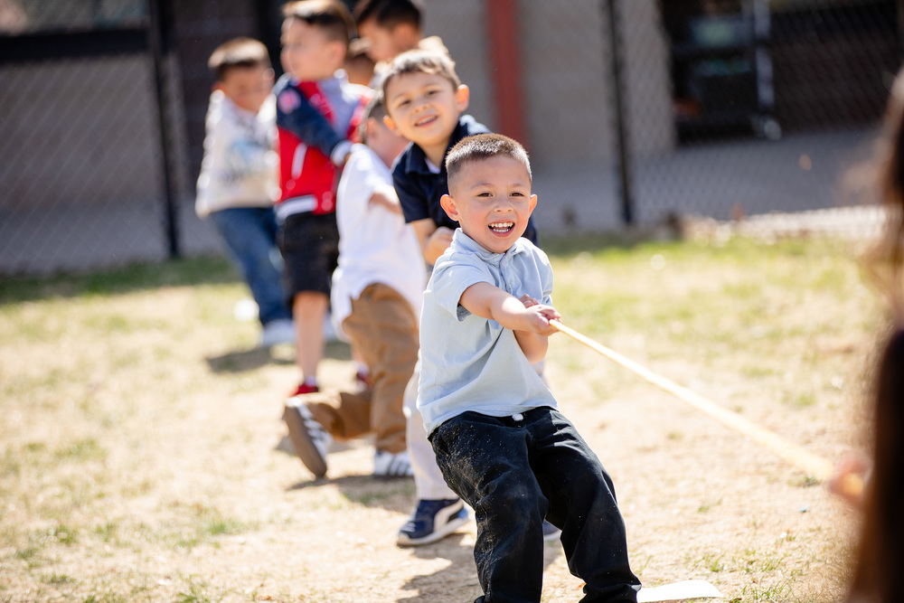 elementary students playing tug-of-war