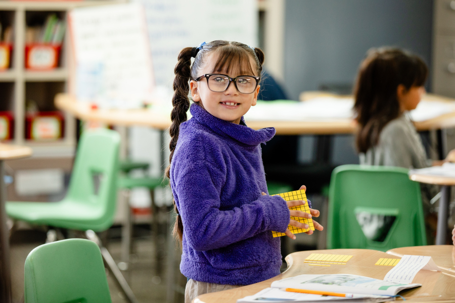 A student holds a tool to help with counting in math class.