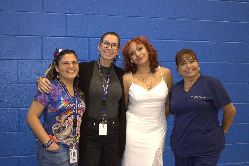 NEC students and staff pose and smile