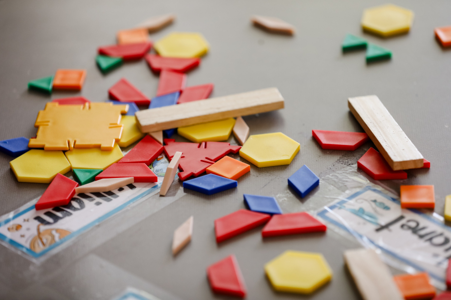 plastic toys in different colors and shapes on a desk