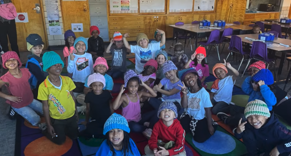 Students in hand kits beanies