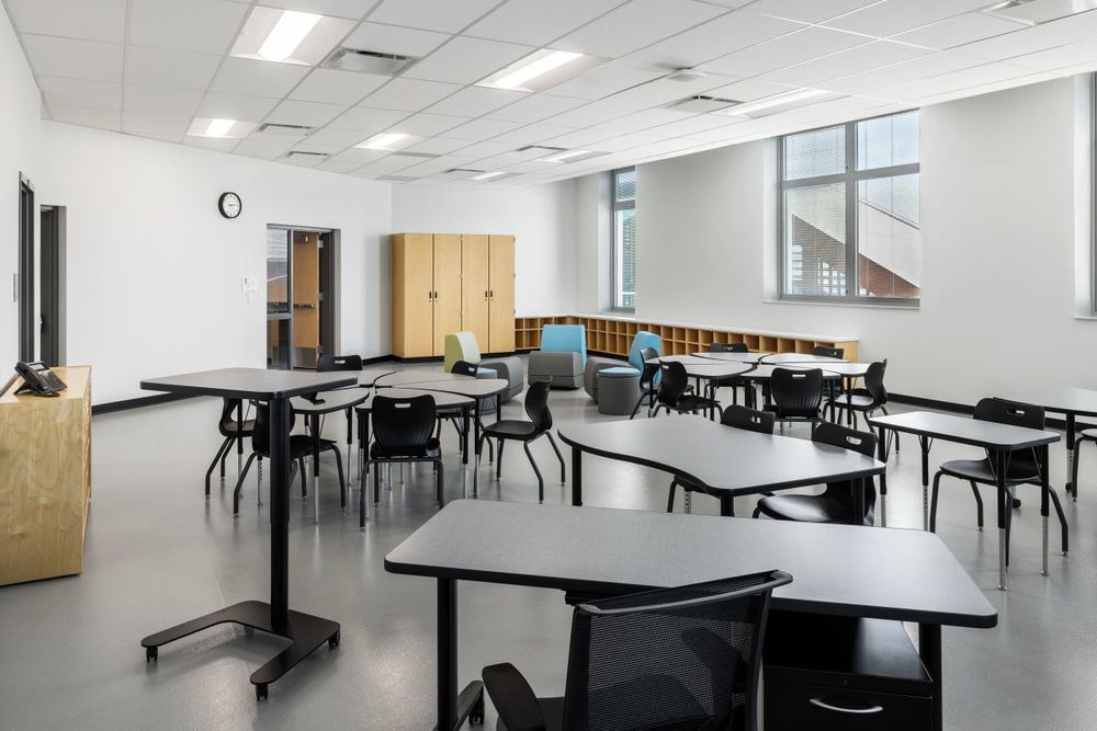 empty classroom with 5 desks