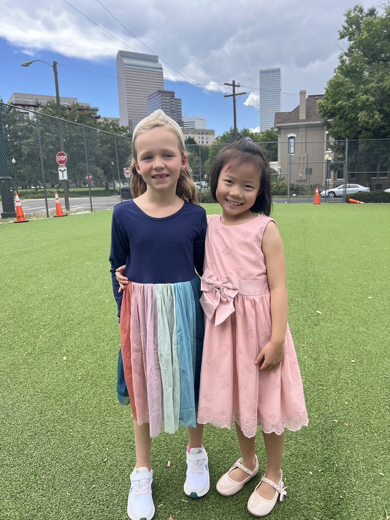 2 girls on a playing field