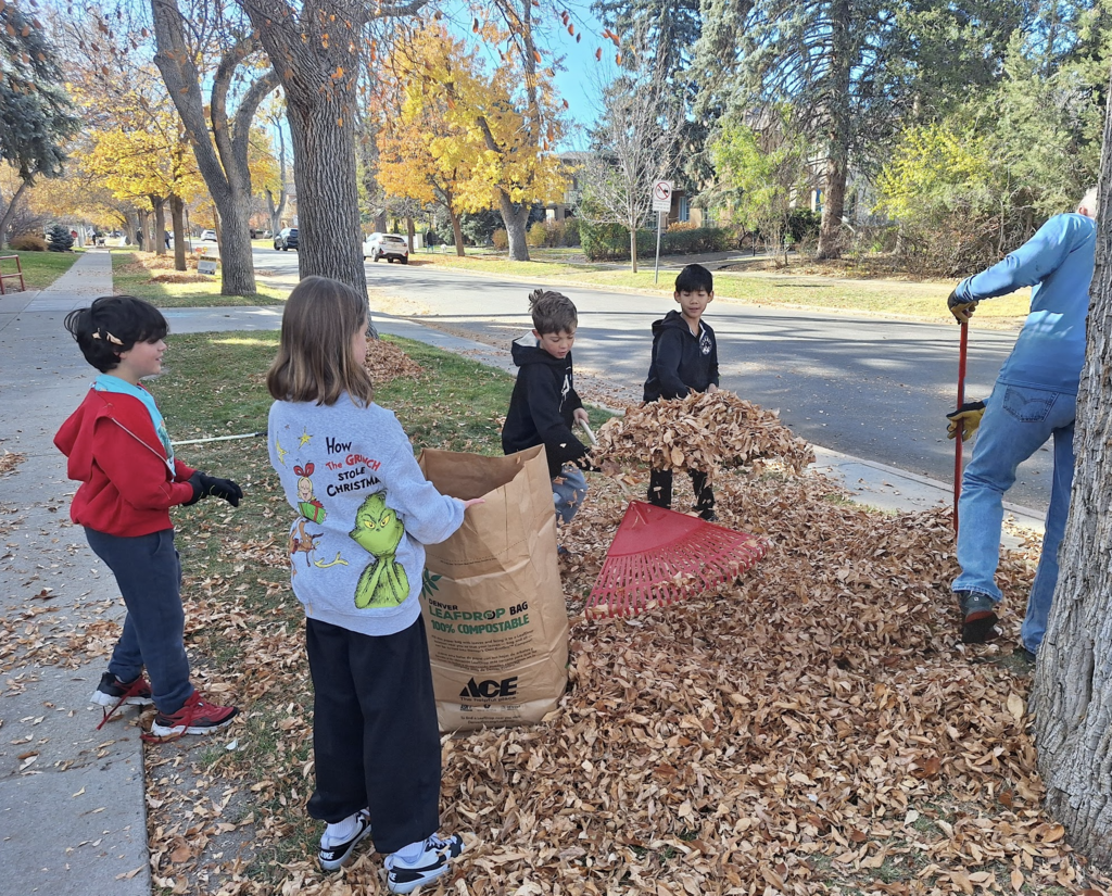 Students raking leaves