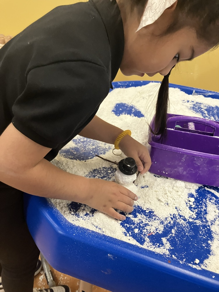 we made, mostly melted, snowmen in the sensory table