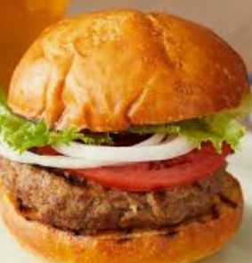 Burger with lettuce, onions, and tomato 