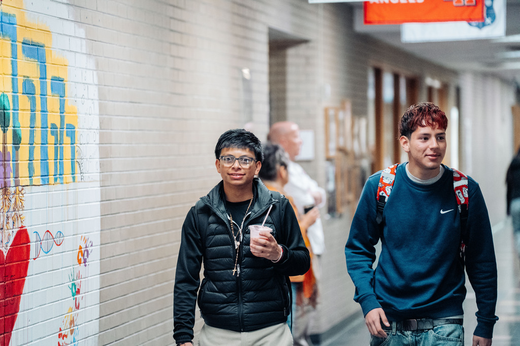Two mlae students in the hallway during passing period at CEC Early College