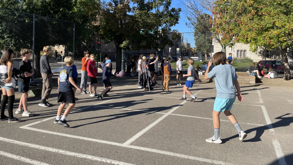 Boys playing four square