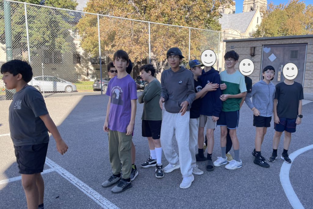 Boys playing 4 square