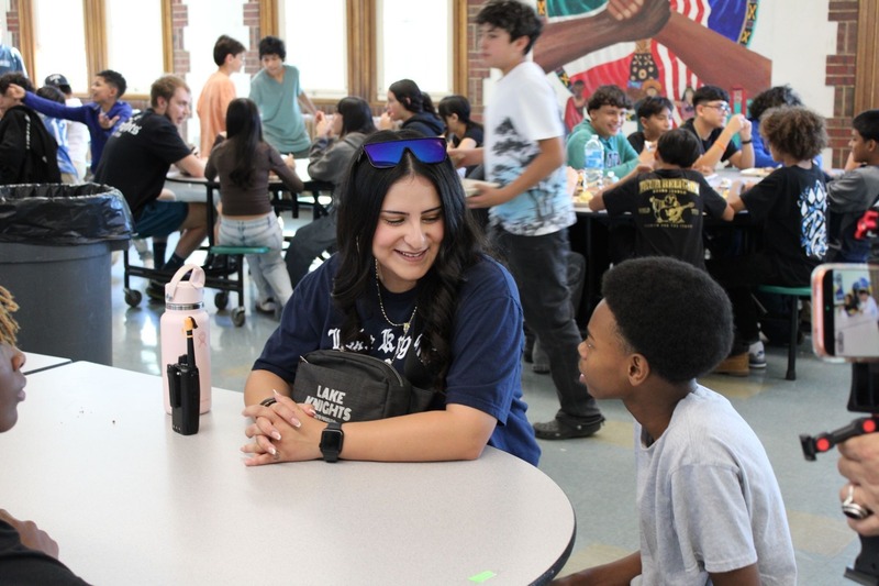 Teacher talking with student