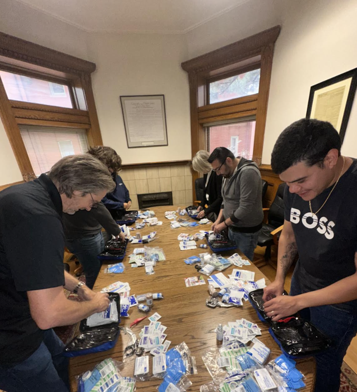 Wilhite Law Firm Employees Assembling First Aid Kits
