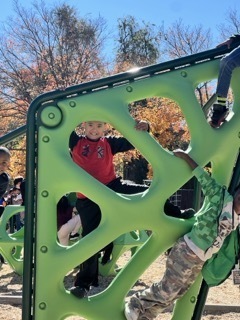 student on play equipment