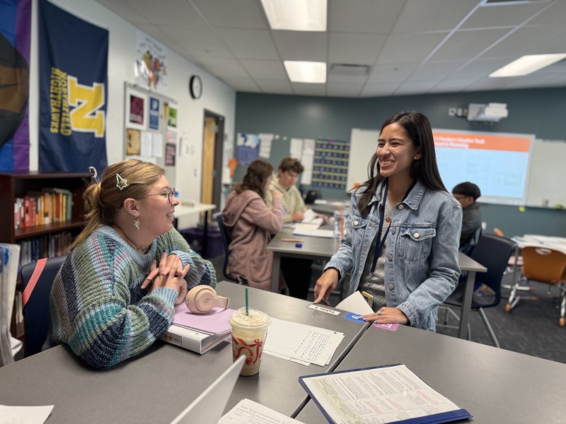 Nathania sharing a laugh with a student