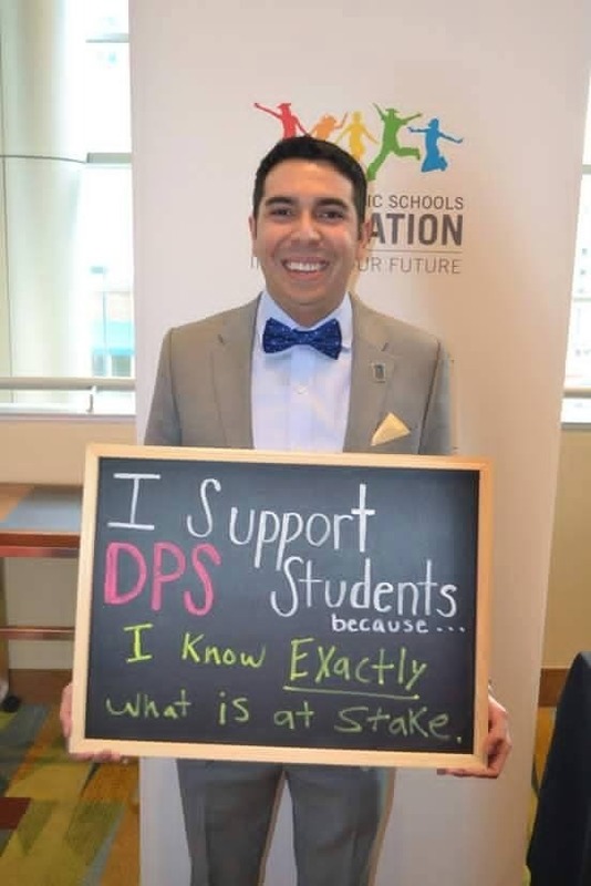 Dr. Solano with a chalkboard reading "I support DPS students because I know exactly what is at stake."