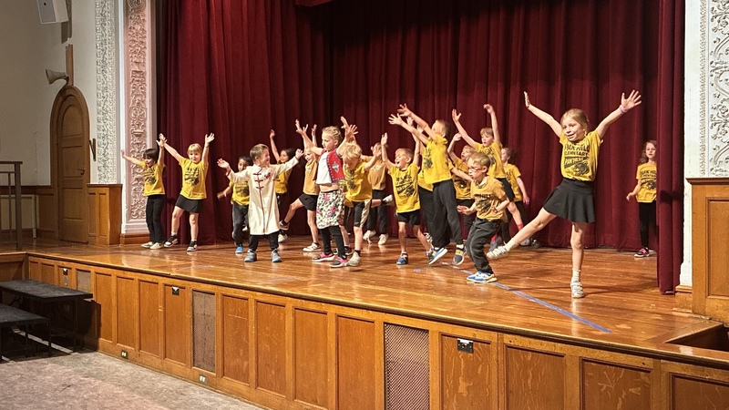Students dancing on a stage