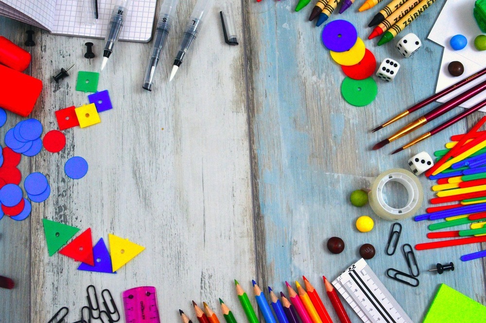 elementary school supplies laid out on a table