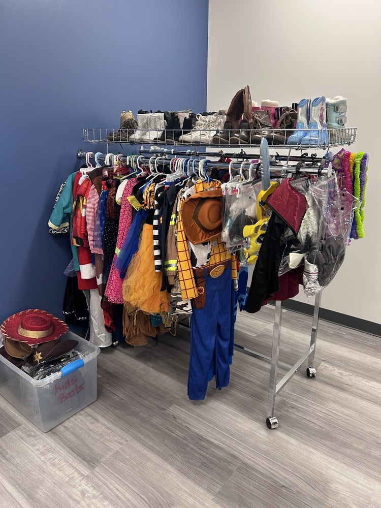costumes on display on clothing rack