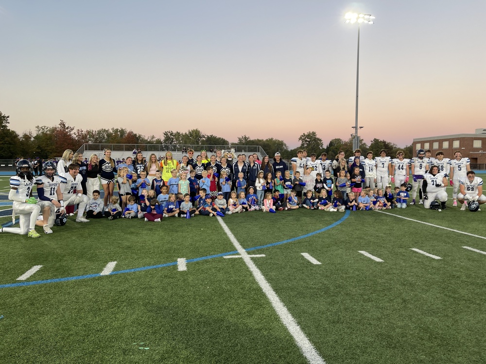 Seniors pose with Cayuga students