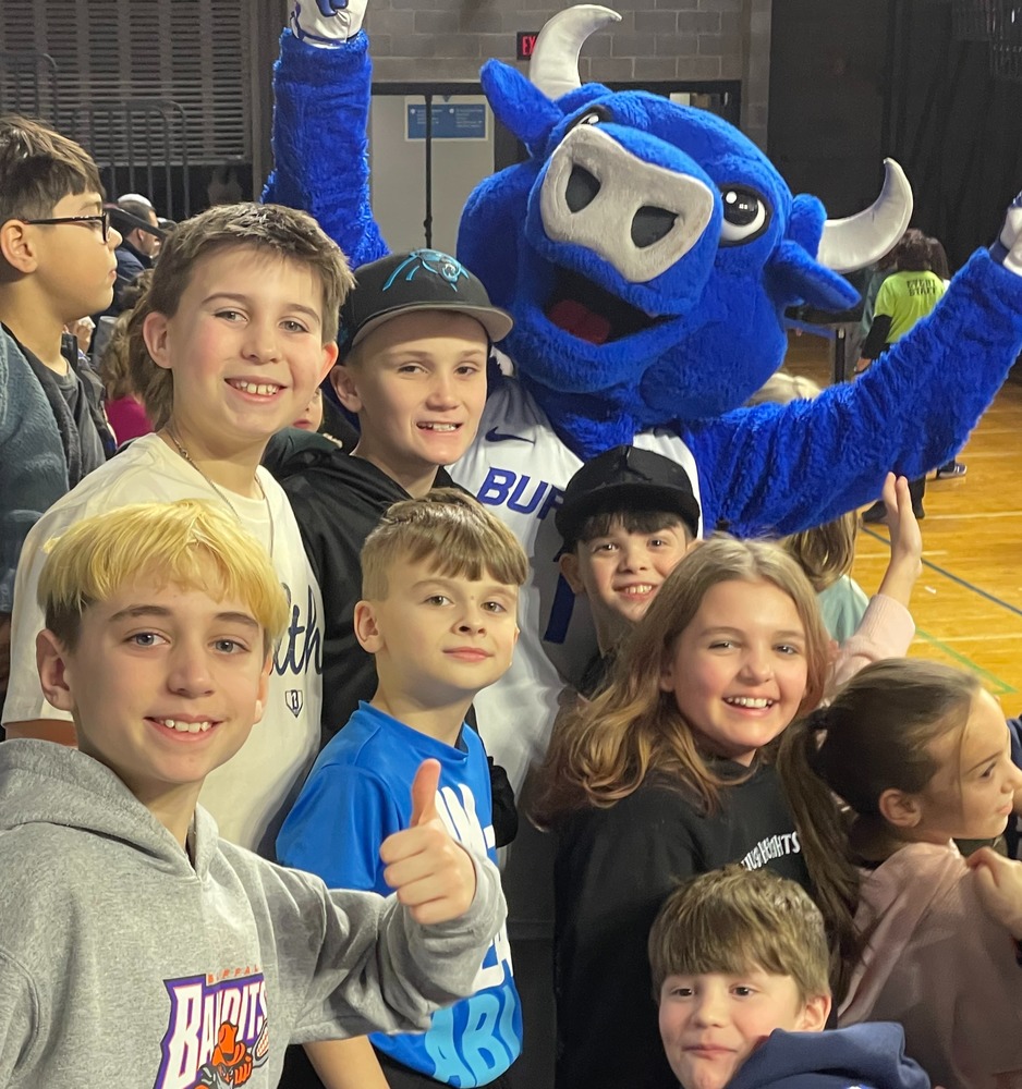Students have fun at a basketballl game.