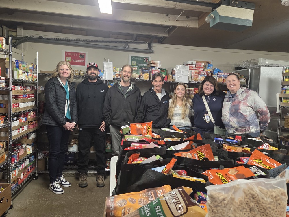 Superintendent Katie Smith stands with fellow Depew staff and volunteers at Tri-Community Food Pantry.