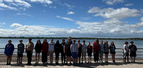 Students pose for a photo at Beaver Island.