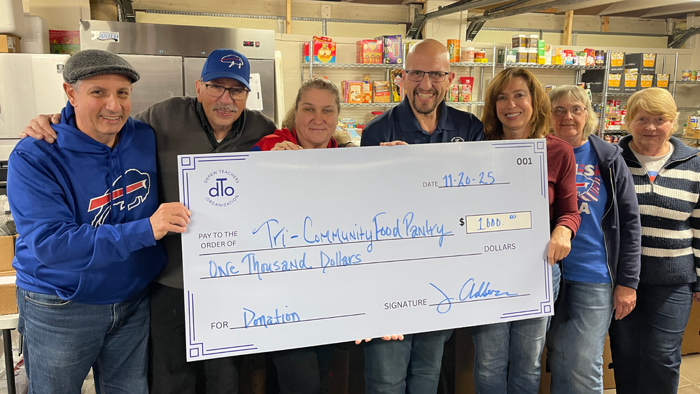 Sal Carlino presents check to Tri-Community Food Pantry Volunteers