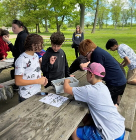 Students pose for a photo at Beaver Island.