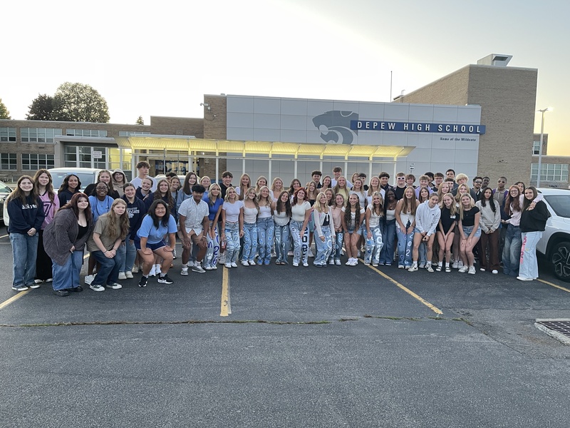seniors pose in parking lot