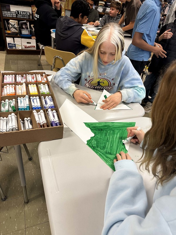 Students work and decorate doors at LMS.
