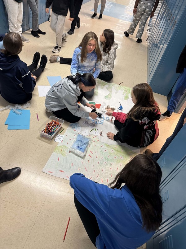 Students work and decorate doors at LMS.