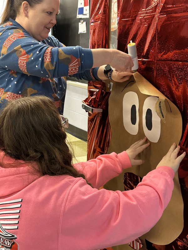 Students work and decorate doors at LMS.