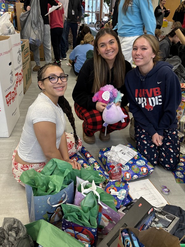 students pose while volunteering at annual day of giving