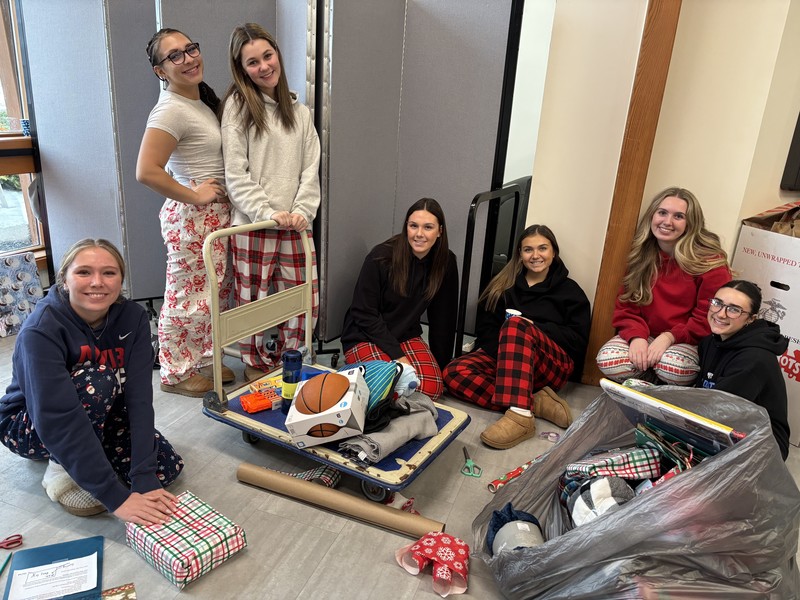 students pose while volunteering at annual day of givin