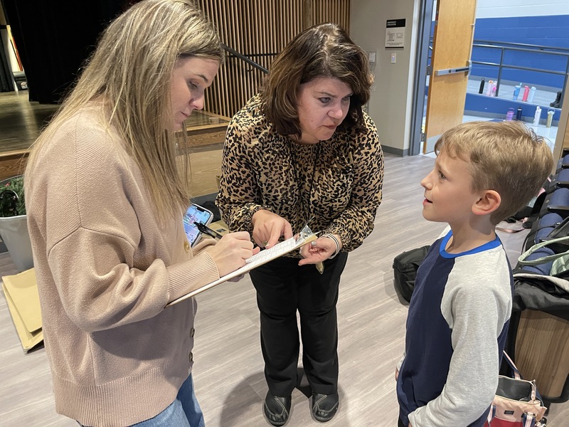 teachers give student instruction on his next scene