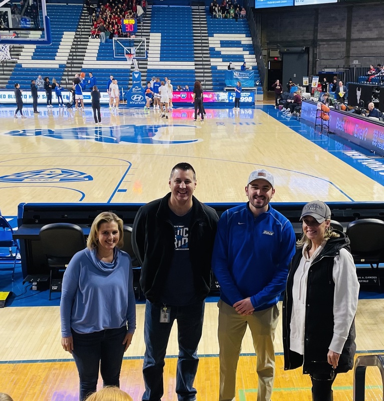 Students have fun at a basketballl game.