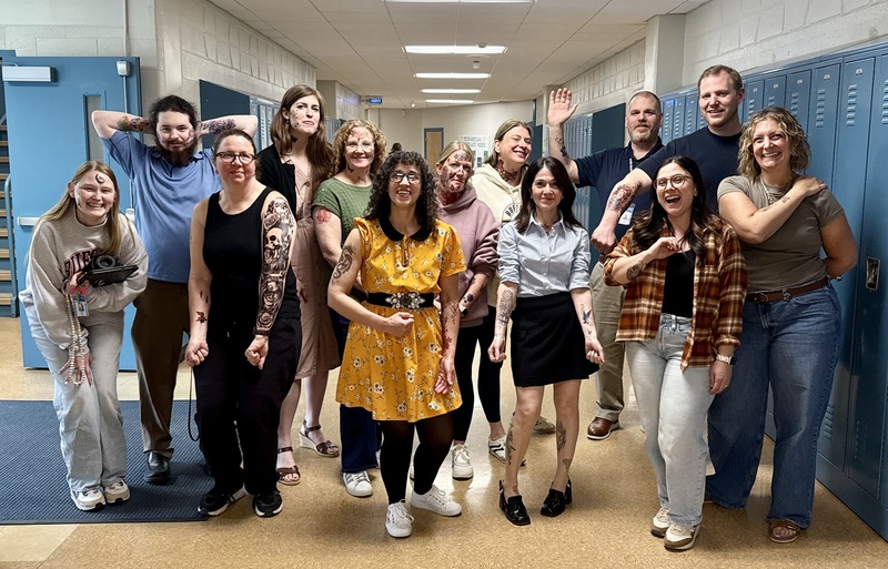 Teachers show off their tattoos for the Tattoo a Teacher Fundraiser