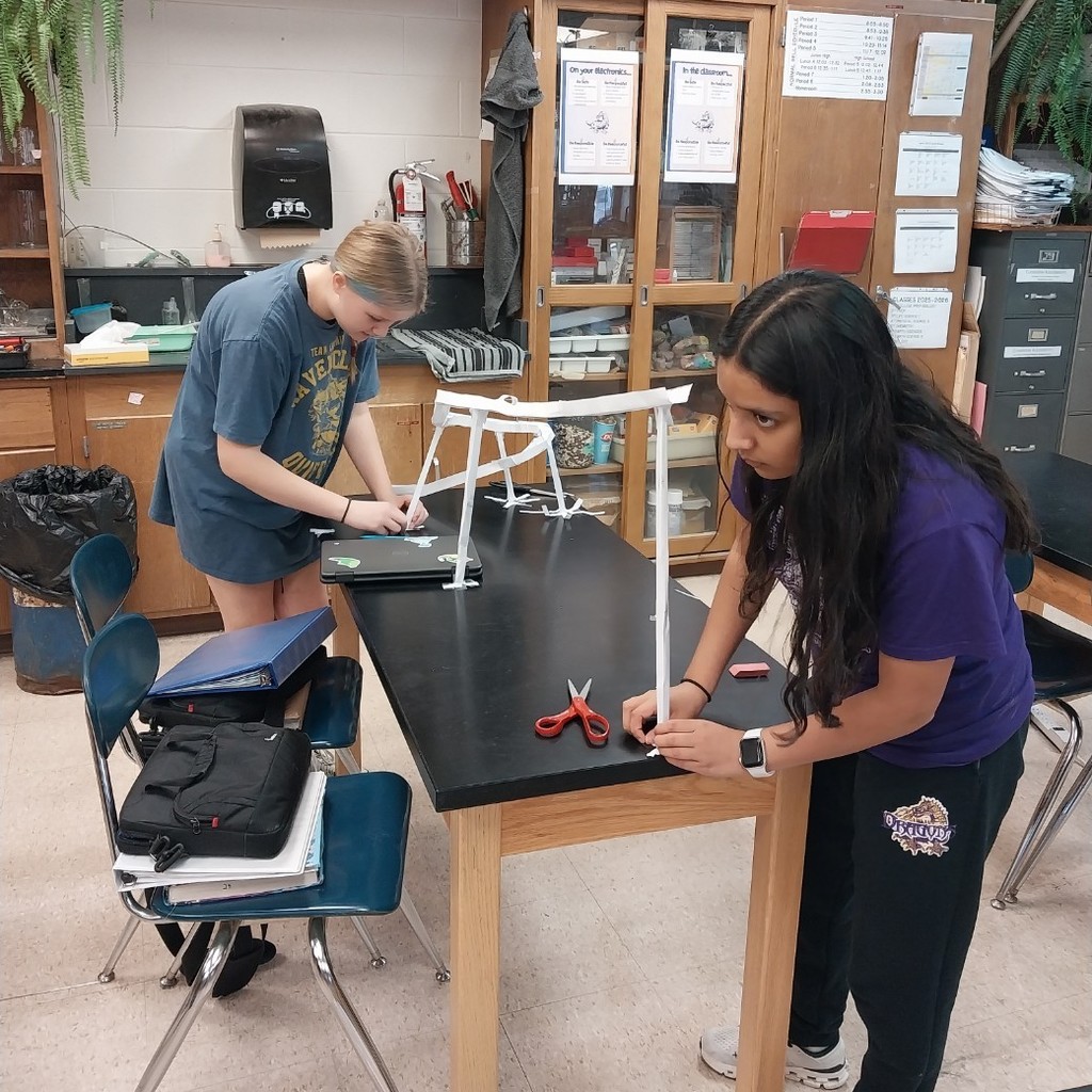 Selena and Fallyn working on their marble roller coaster.