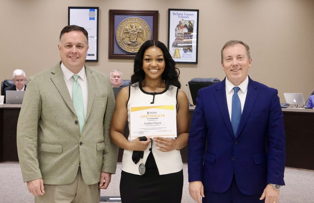 The School Board & Supt. Cory Uselton presented at 30+ medal and certificate to Lake Cormorant High School senior Kaitlyn Payne. Also pictured is Dr. Bobby Davis, principal of LCHS.