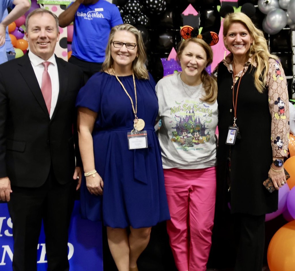 Principals smiling for the camera