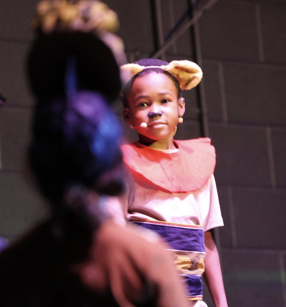 student performing in lion king