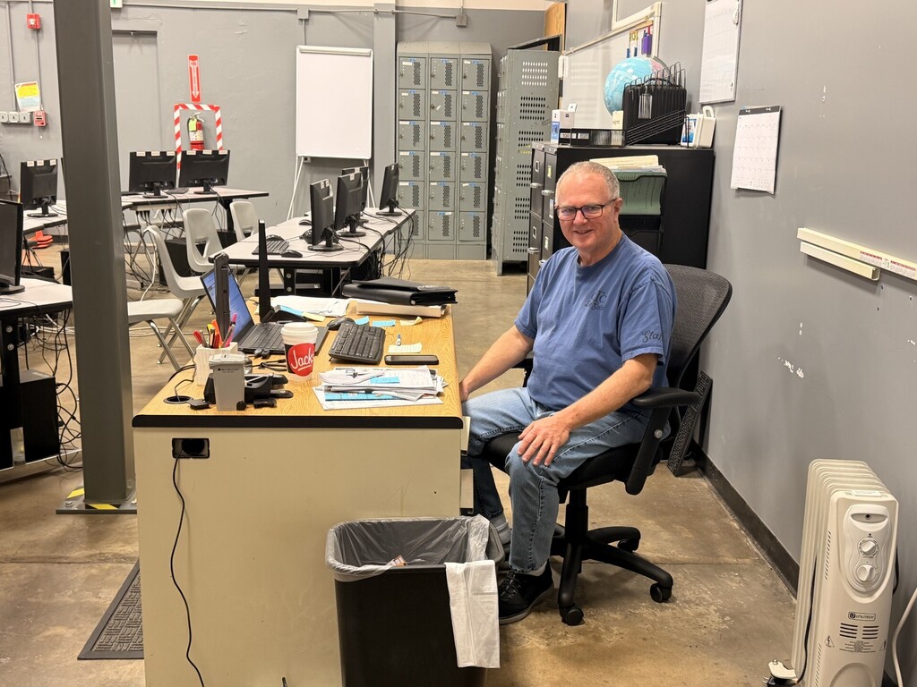 Mr. Doss working at his desk