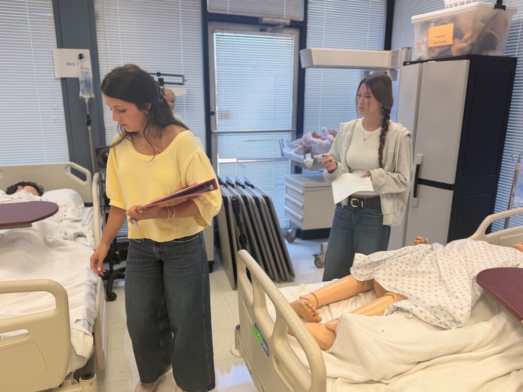 two students checking out the med lab