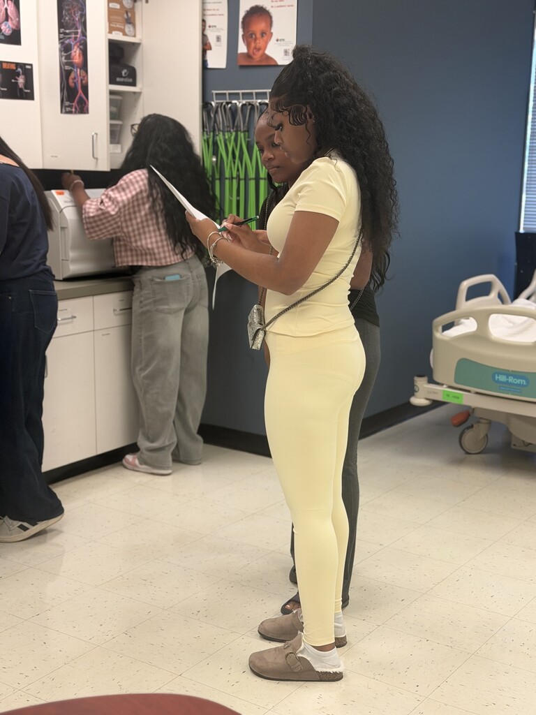 students looking at medical checklist