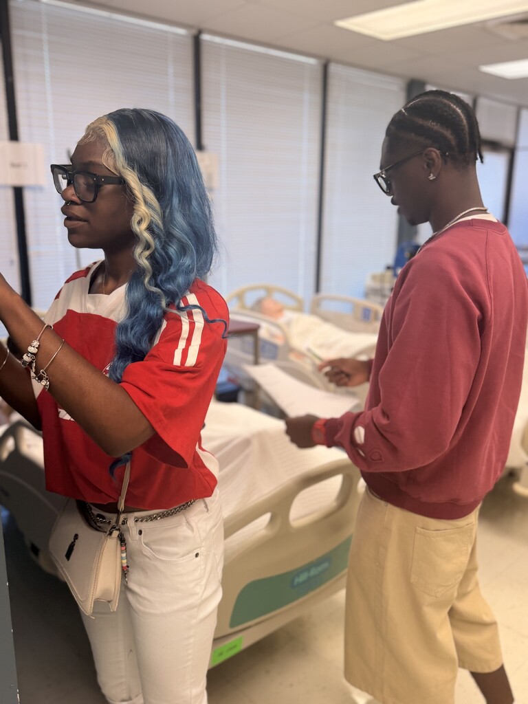 two students looking at a checklist
