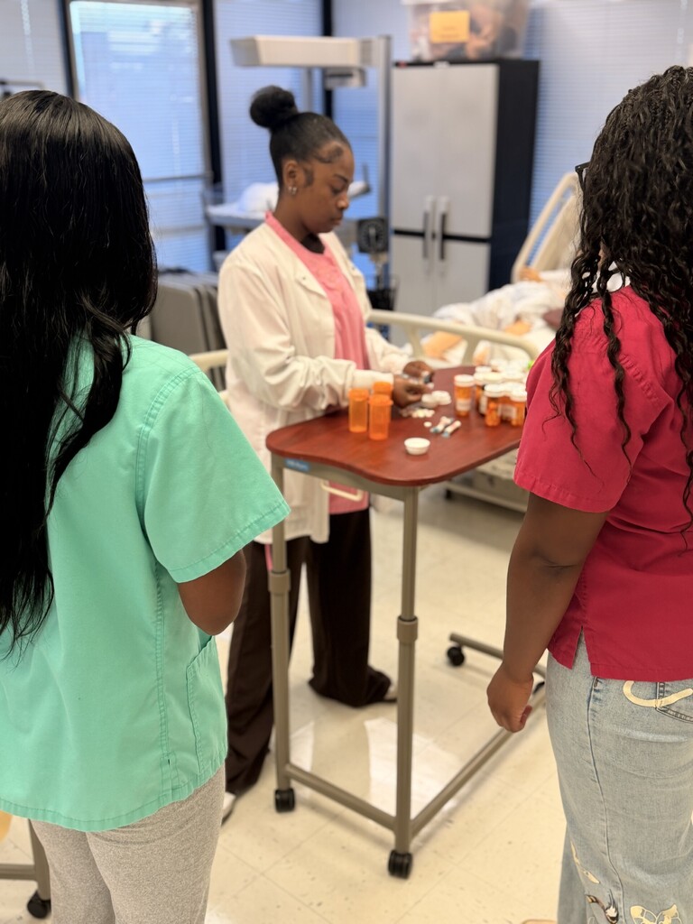 student counting out prescription meds