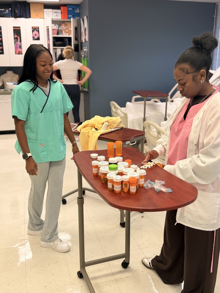 student counting out prescription meds