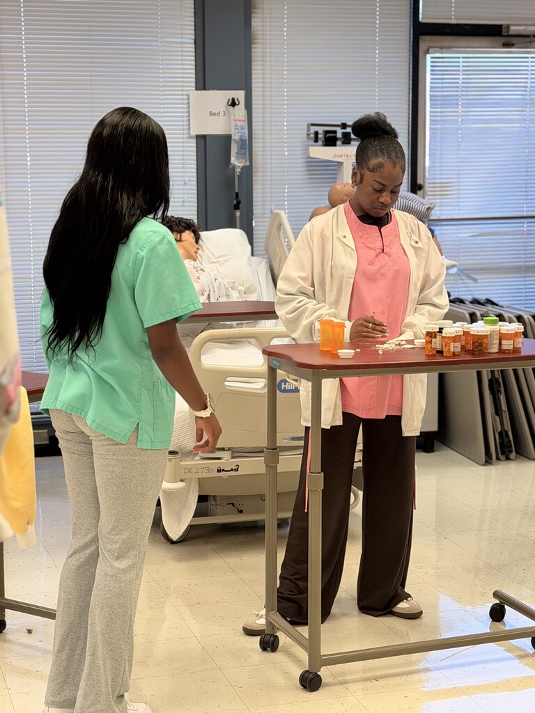 student counting out prescription meds