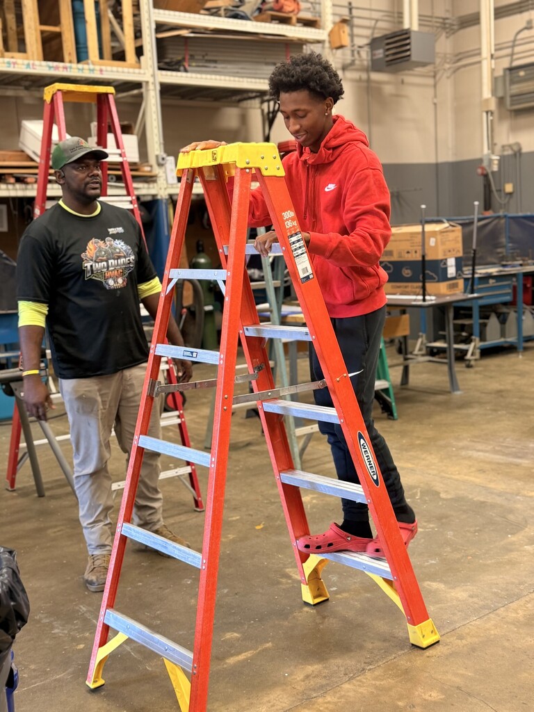 student on ladder learning ladder safety