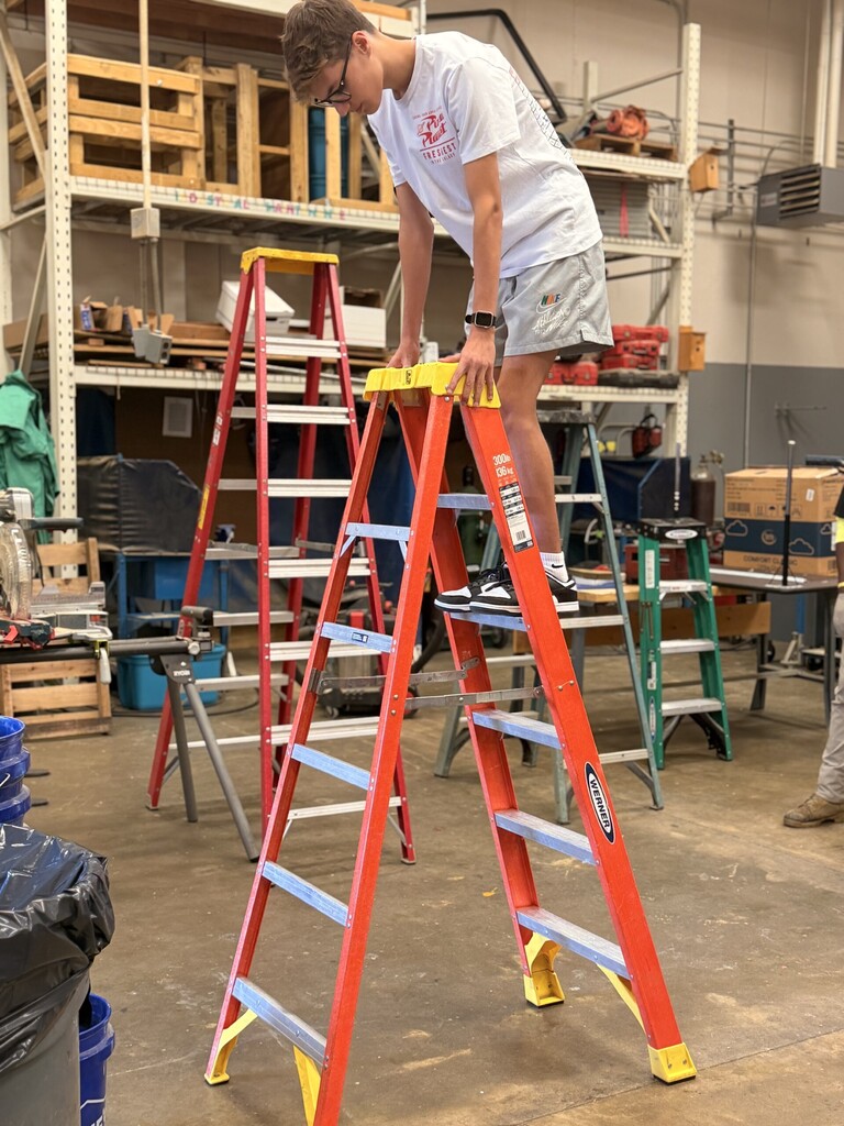 student on ladder learning ladder safety
